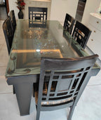 6 seater dining table - glass top and chair detail