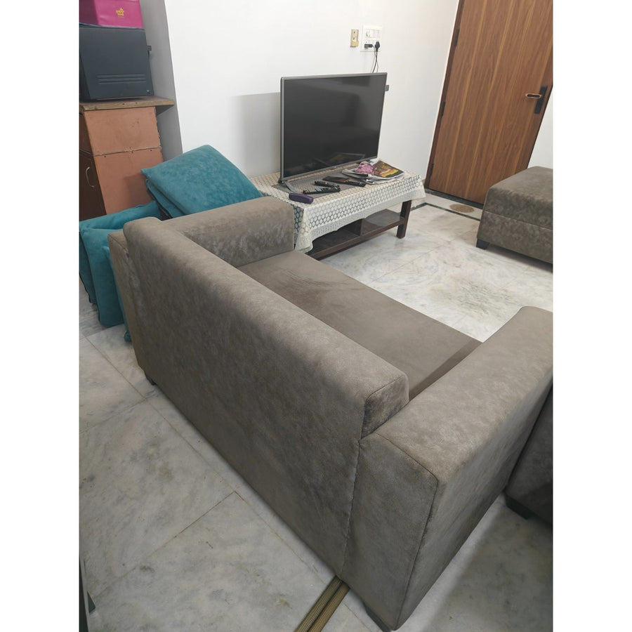 Grey 2-seater sofa — seller photograph 1 (square padded)