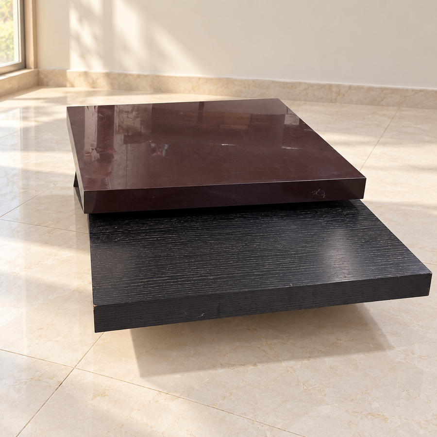 Regularly used two-tone centre table with visible surface scratches