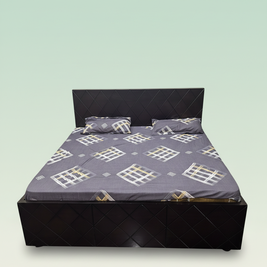 Bed with a patterned bedspread and pillows on a light green background