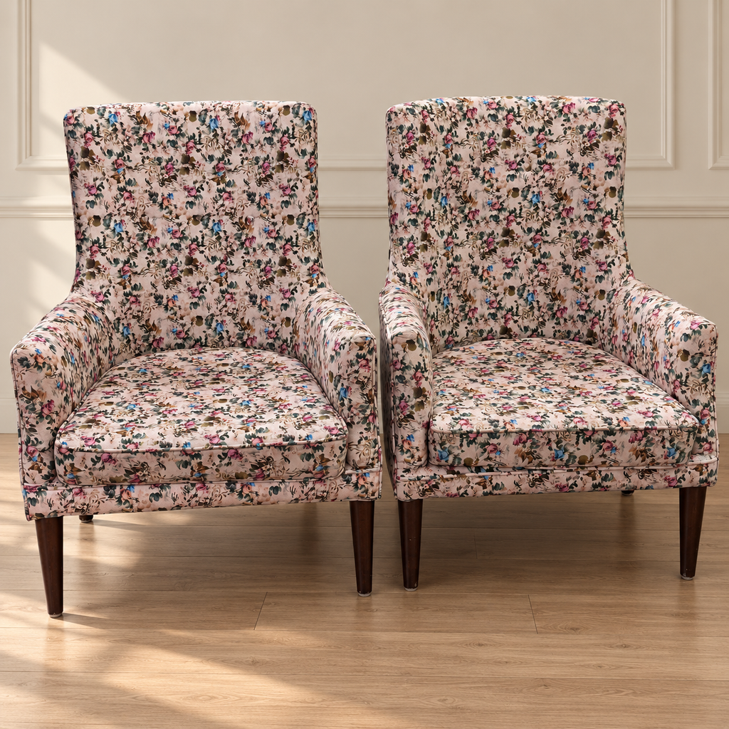 Pair of pre-owned floral upholstered wingback lounge chairs in neutral room