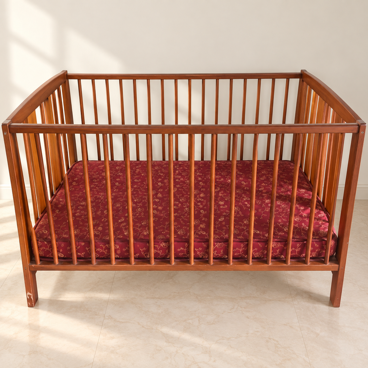 Wooden Baby Cot with Mattress in a neutral room
