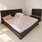 Wooden Double Bed with Bedside Shelf Unit in a neutral room