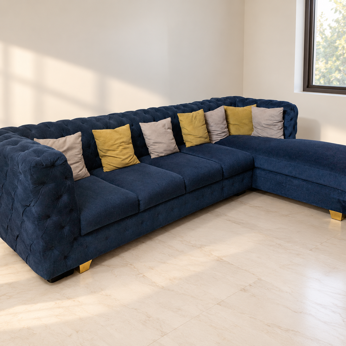 Navy Tufted L-Shaped Sofa with Chaise in a neutral room
