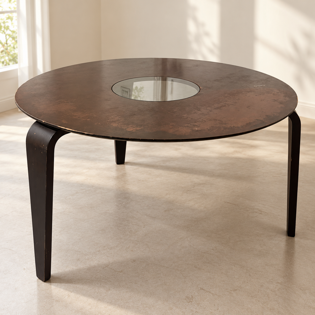 Used round dining table with visibly worn finish