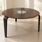 Used round dining table with visibly worn finish