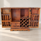Pepperfry Sheesham Wood Bar Unit with Wine Rack — photographed resale item in a neutral room