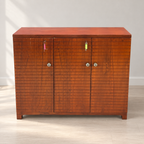 Wooden Bar Cabinet with Glass Holders — photographed resale item in a neutral room