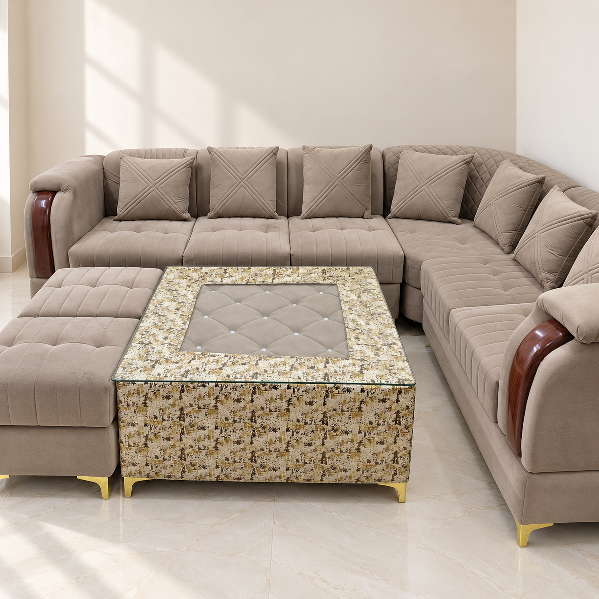 Velvet L-shaped sofa with centre table and stools in a neutral room