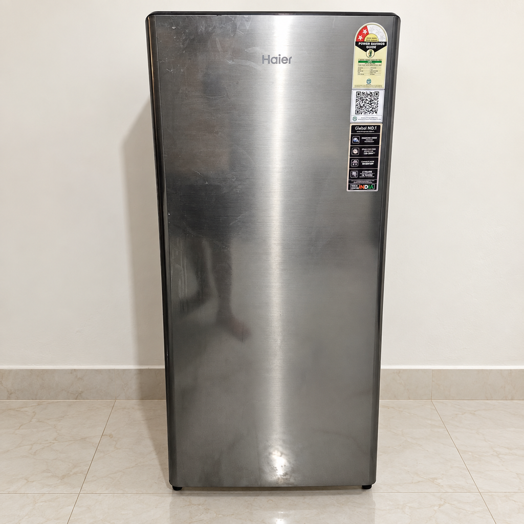 Pre-owned Haier 215 L single-door refrigerator with smudges visible