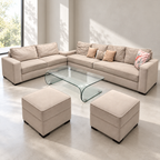 L-shape sofa set with two pouffes and curved glass centre table in a softly lit neutral living room