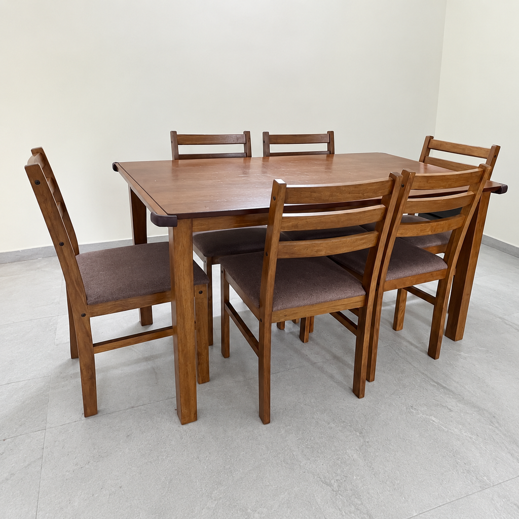 Pre-owned brown six-seater dining set with light tabletop marks in a neutral room