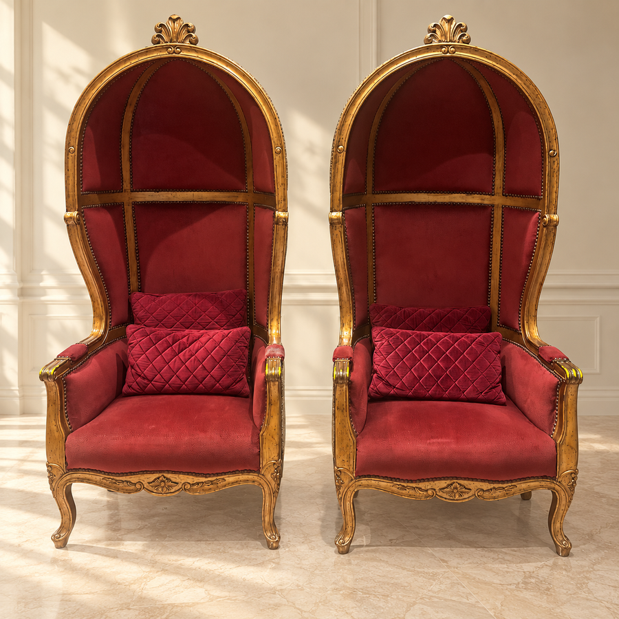 Pair of pre-owned carved red velvet canopy chairs in neutral room